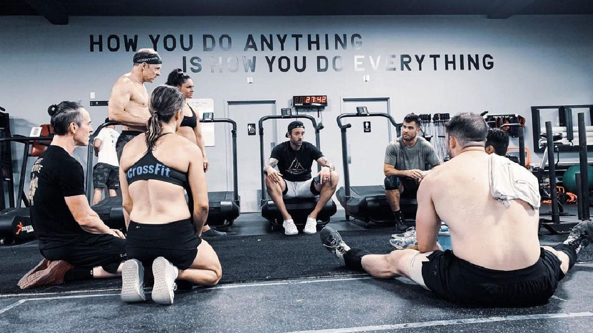 Crossfit Coach Teaching Gym Members